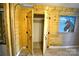 Open closet featuring faux wood paneling and black iron hardware at 416 E Union St, Marshville, NC 28103