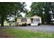 Charming one-story home with accessible ramp, and gravel driveway at 416 E Union St, Marshville, NC 28103