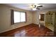 Living room featuring hardwood floors, a ceiling fan, and natural light at 416 E Union St, Marshville, NC 28103