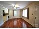 Living room with hardwood floors, ceiling fan, and natural light at 416 E Union St, Marshville, NC 28103