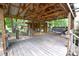 Spacious outdoor deck with wood flooring and a covered shelter at 416 E Union St, Marshville, NC 28103