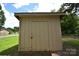 External shot of the storage shed, featuring light yellow painted panels at 416 E Union St, Marshville, NC 28103