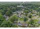 An aerial shot of the property close to the Southpark neighborhood surrounded by lush green foliage at 504 Wakefield Dr # A, Charlotte, NC 28209