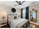 Inviting bedroom with patterned wallpaper, ceiling fan, and hardwood floors at 504 Wakefield Dr # A, Charlotte, NC 28209