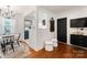 Bright dining area with modern chandelier and access to the kitchen at 504 Wakefield Dr # A, Charlotte, NC 28209