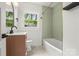 Bathroom featuring fresh paint, modern fixtures, and natural light at 5320 Kildare Dr, Charlotte, NC 28215