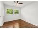 Bedroom with natural light, hardwood floors, and a modern ceiling fan at 5320 Kildare Dr, Charlotte, NC 28215