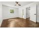 Bright bedroom with hardwood floors, modern ceiling fan, and natural light at 5320 Kildare Dr, Charlotte, NC 28215