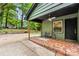 Cozy covered patio with brick flooring and a ceiling fan, perfect for outdoor relaxation at 5320 Kildare Dr, Charlotte, NC 28215