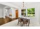 Inviting dining area with ample natural light and wood floors at 5320 Kildare Dr, Charlotte, NC 28215