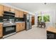 Updated kitchen flowing into dining area, with stainless steel appliances at 5320 Kildare Dr, Charlotte, NC 28215