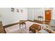 Bright living room featuring hardwood floors, an area rug, and a mid-century modern aesthetic at 5320 Kildare Dr, Charlotte, NC 28215