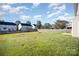 Expansive backyard featuring a large grassy area and partial wooden fence at 5805 Lindley Crescent Dr, Indian Trail, NC 28079