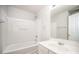 Bathroom with tub and shower, vanity, neutral tile, and door at 5805 Lindley Crescent Dr, Indian Trail, NC 28079