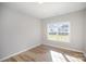 Cozy bedroom with a large window and wood-look flooring at 5805 Lindley Crescent Dr, Indian Trail, NC 28079