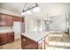 Spacious kitchen with a center island, dark wood cabinets, and pendant lighting at 5805 Lindley Crescent Dr, Indian Trail, NC 28079