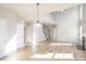 Bright and spacious living room with vaulted ceilings, fireplace, and hardwood floors at 5805 Lindley Crescent Dr, Indian Trail, NC 28079