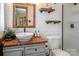 Charming bathroom boasts a vessel sink, wood accents, shiplap walls, and stylish decor at 5922 Sullins Rd, Charlotte, NC 28214