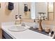 Bathroom features a modern faucet, vanity sink, and clean, white countertops at 5922 Sullins Rd, Charlotte, NC 28214