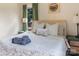 Cozy bedroom features a comfy bed, soft lighting, and view of the backyard at 5922 Sullins Rd, Charlotte, NC 28214