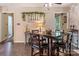 Cozy dining area featuring a dark wood table set and views leading to additional rooms at 5922 Sullins Rd, Charlotte, NC 28214