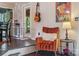 Cozy entryway showcasing a comfortable chair, stylish guitar, and a vibrant Van Gogh art piece at 5922 Sullins Rd, Charlotte, NC 28214