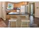 Functional kitchen featuring an island, ample cabinetry, and modern appliances at 5922 Sullins Rd, Charlotte, NC 28214