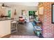 Cozy living area with barstool seating and access to a patio and outdoor space at 5922 Sullins Rd, Charlotte, NC 28214