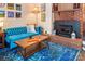 Comfortable living area featuring a brick fireplace and contemporary furniture at 5922 Sullins Rd, Charlotte, NC 28214