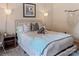 Lovely bedroom features pendant lighting, stylish decor, and a plush upholstered headboard at 5922 Sullins Rd, Charlotte, NC 28214