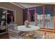 Outdoor dining space with metal table and chairs, plus view to screened porch and home exterior at 5922 Sullins Rd, Charlotte, NC 28214