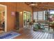 Comfortable screened porch with string lights, rug, and outdoor furniture perfect for relaxing and entertaining at 5922 Sullins Rd, Charlotte, NC 28214