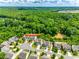 An aerial view of the home is situated on a cul-de-sac with mature trees and lush landscaping at 6243 Kilchurn Dr, Indian Land, SC 29707