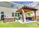 Beautiful outdoor space features a hot tub and covered area with comfortable seating at 6243 Kilchurn Dr, Indian Land, SC 29707