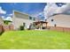 Great outdoor fenced-in area with covered seating and fire pit, perfect for entertaining at 6243 Kilchurn Dr, Indian Land, SC 29707