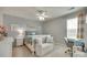 Charming bedroom with whimsical decor featuring a bed with throw pillows and a cozy chair and desk area at 6243 Kilchurn Dr, Indian Land, SC 29707