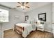 Cozy bedroom with a ceiling fan, a comfortable bed, and natural light at 6243 Kilchurn Dr, Indian Land, SC 29707