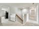 Upstairs hallway with carpeted floor and a view of staircase at 6243 Kilchurn Dr, Indian Land, SC 29707
