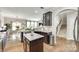 Spacious kitchen island with granite countertops and views into the adjacent living spaces at 6243 Kilchurn Dr, Indian Land, SC 29707