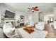 Inviting living room with a fireplace, ceiling fan, and comfortable seating arrangement at 6243 Kilchurn Dr, Indian Land, SC 29707