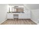 Bright bathroom with dual sink vanity and wood floors at 6811 Kluttz Rd, Concord, NC 28025