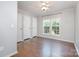 Bedroom with hardwood floors, windows, and spacious closets at 6811 Kluttz Rd, Concord, NC 28025