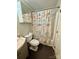 Charming bathroom with nautical-themed shower curtain, vanity and toilet at 6832 Delta Lake Dr, Charlotte, NC 28215