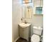 Bathroom featuring a vanity with storage, toilet and illuminated mirror at 6832 Delta Lake Dr, Charlotte, NC 28215
