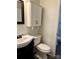 Well-lit bathroom featuring a vanity with storage and a toilet at 6832 Delta Lake Dr, Charlotte, NC 28215
