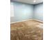 Bright bedroom featuring neutral walls, plush carpet, and a window for natural light at 6832 Delta Lake Dr, Charlotte, NC 28215