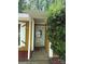 Welcoming front entrance with glass door, white trim, and manicured greenery, showcasing curb appeal at 6832 Delta Lake Dr, Charlotte, NC 28215