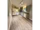 Bright kitchen featuring ample counter space and modern flooring, ready for Gathering meals at 6832 Delta Lake Dr, Charlotte, NC 28215