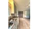 Kitchen with stainless steel sink, plenty of cabinets, and modern flooring, for cooking and dining at 6832 Delta Lake Dr, Charlotte, NC 28215