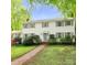 Classic two-story home with white siding, grey shutters, and a manicured lawn, offering timeless curb appeal at 7020 Leesburg Rd, Charlotte, NC 28215